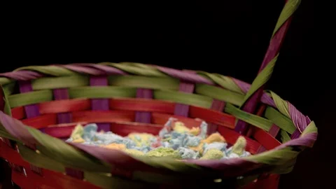 Large pile of easter eggs dumped into basket in slow motion Stock-Footage 87691846