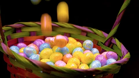 Large pile of easter eggs fall in basket Video stock 87690786