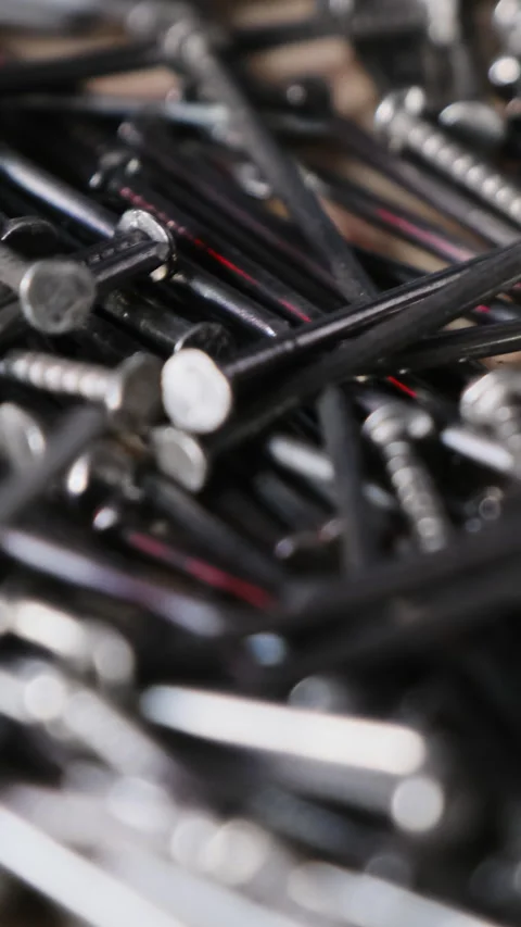 Large pile of metallic nails emphasizes quantity and textture Stock Footage 316163098