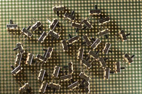 Large pile of on / off microswitches with mechanical latching Stock Photos