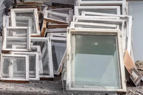 Large pile of old windows with frames is after replacing new windows in the b Fotos Stock