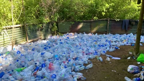 Large Pile of Plastic Bottles and Waste in an Outdoor Area Video stock 341837989