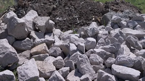 Large Pile of Rough Gray Rocks and Dark Soil at Construction Site Video stock 339086231