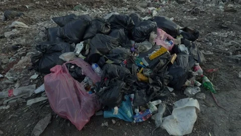 A Large Pile of Various Mixed Waste in an Urban Environment and its associated Stock Footage 311591195