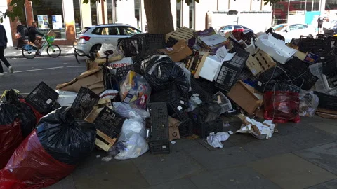 Large piles of garbage left uncollected on the street. Stock Footage 251441091