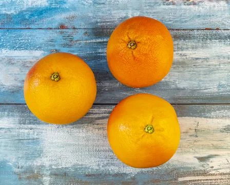 Large pink grapefruits on a table Stock Photos