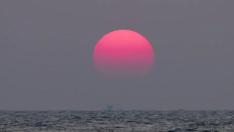 Large pink sun set over horizon timelapse. Beautiful sunset landscape time lapse Stock Footage 237918522