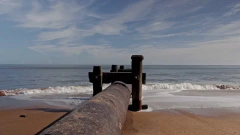 Large pipe descending into the sea Stock Footage 230981431