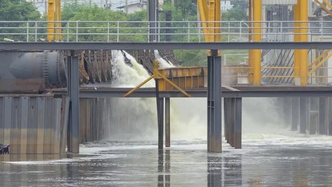 Large pipe flowing water into canal Stock Footage 78551676