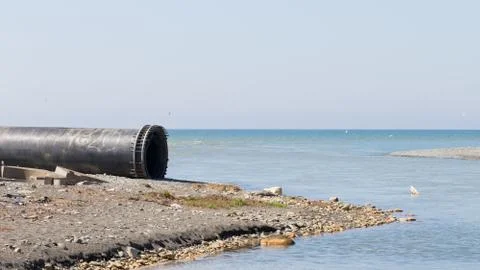 Large pipe by the sea Stock Photos