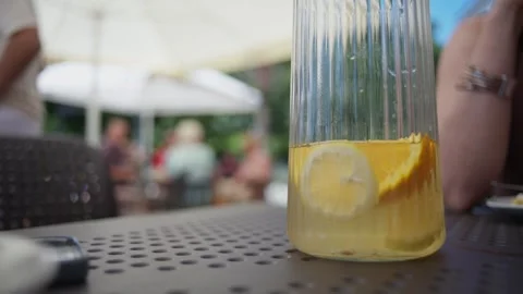 Large Pitcher Of Cold Lemonade On A Table Stock Footage 341594545