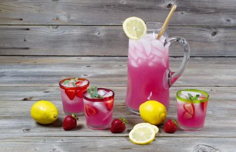 Large pitcher of lemonade with glassware Stock Photos