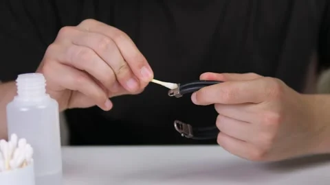 A large plan of mens hands cleaning the precious part of a bracelet. Jewelry and Stock Footage 314033827