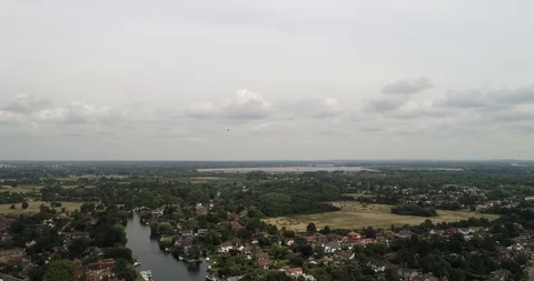 Large plane flies over congested residential area towards London drone aerial 4k Stock Footage 124647442