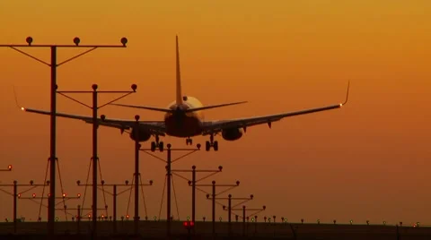 Large plane landing at sunset Video stock 8839434
