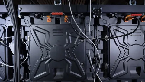 A large plasma screen in the cinema is lowered onto the stage. Stock-Footage 146348553