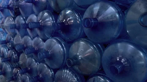 Large plastic empty bottle. A range of custom made empty 5 gallon Stock Footage 158338508