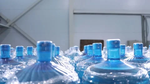 Large plastic empty bottle. A range of custom made empty 5 gallon refillable  Stock Footage 158511977