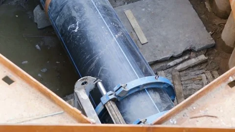 Large plastic sewer pipe PEX ready for installation with special hydraulic equip Stock Footage 81917326