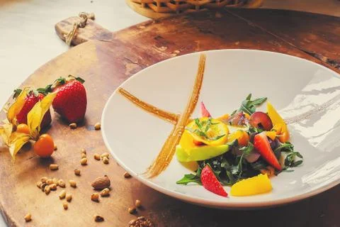 A large plate with different types of tropical colored fruit. Food for vegeta Stock Photos
