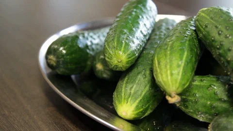 Large plate with fresh cucumbers. cucumbers are not cut.close-up. Stock Footage 114739937