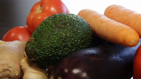 Large plate with fresh vegetables. ginger, carrots, tomatoes, eggplant, avocado Video stock 122412035