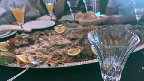 Large Platter of Fish Bones and Leftovers After Big Stock Footage 318848334