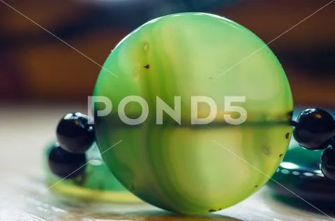 Large polished beads of beautiful translucent green agate gemstone, macro Stock Photos