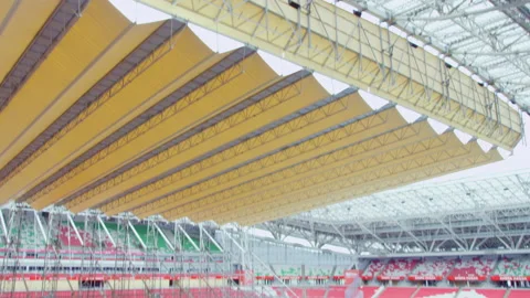 Large pool in process of building under massive yellow roof Stock Footage 229843453