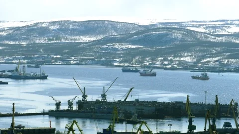 A large port on the river, docks, ships and cranes. Stock Footage 83821296