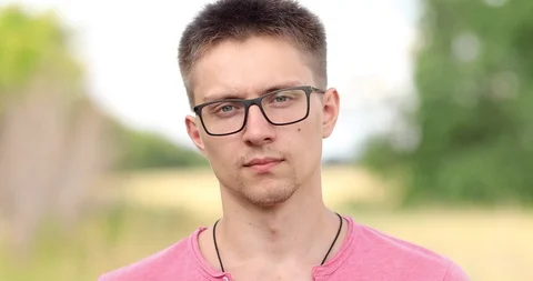 Large portrait of a guy with glasses Stock Footage 114059506