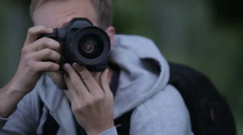 A Large Portrait Of A Man With A Camera That Shoots Photos Stock Footage 63147817
