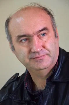 Large portrait of a man. Classical. Setting, dynamics. Jacket Stock Photos