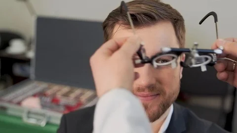 Large portrait of pretty man picks up lenses Video stock 126494461