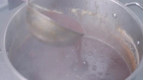 A large pot with almost ready jam Stock Footage 129993328