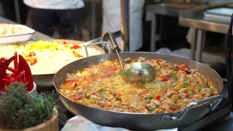 Large Pot of Savory Stew Simmering in Busy Commercial Kitchen Stock Footage 321367053