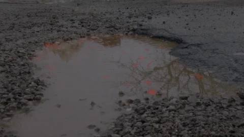 Large pothole, Car wheel Stock Footage