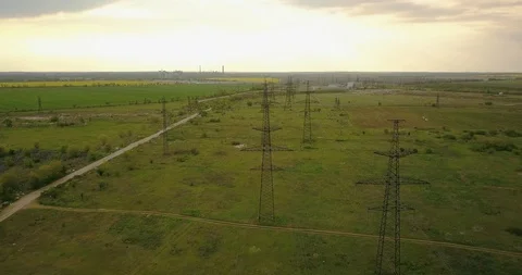 Large power lines in the countryside in spring Stock Footage 129847086