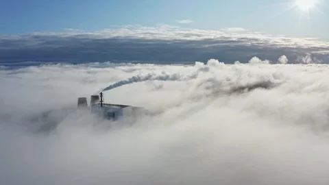 Large power plant pipes create dense white steam clouds Stock Footage 129728496