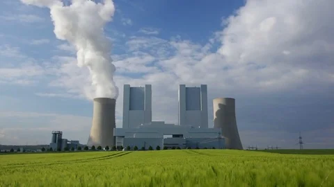 Large Power Station Behind Rye Field Stock Footage