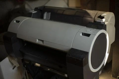 Large printer for printing on paper. Printing equipment in the garage. Inkj.. Stock Photos