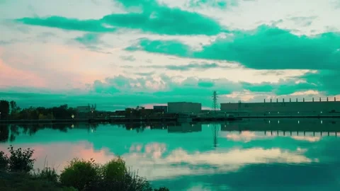 Large pulp and paper mill with a large river in the foreground, with complex Stock Footage 320943158