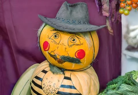 Large pumpkin originally executed as an amusing figurine. Stock Photos