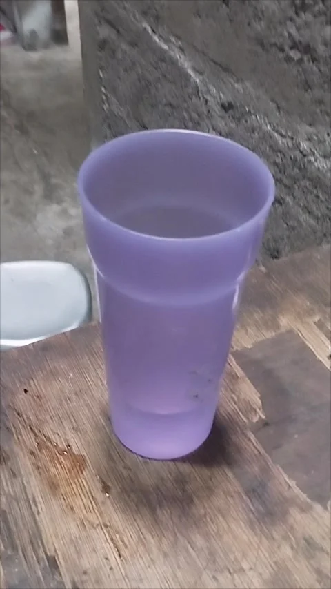 Large purple plastic cup Stock Footage 293056638