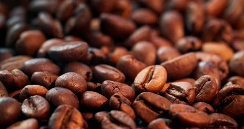 Large quantities of roasted arabica beans. Camera movement, macro photography Stock Footage 155415856