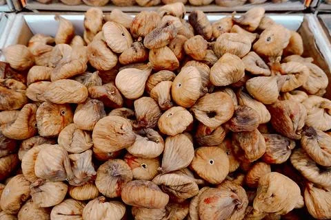 Large quantity of dried figs is stacked together in a grocery shop. The figs Stock Photos