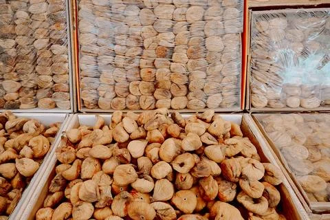 Large quantity of dried figs is stacked together in a grocery shop. The figs Stock Photos