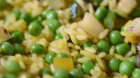 Large quantity of rice with vegetables paella, fast moving camera Stock Footage 112353064