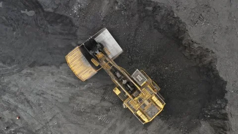 Large quarry dump truck. Loading rock in dumper. Loading coal into truck. Mining Stock Footage 289706517