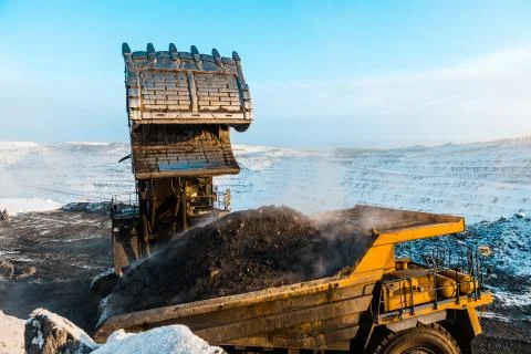 Large quarry dump truck. Loading the rock in dumper. Loading coal into body 写真素材